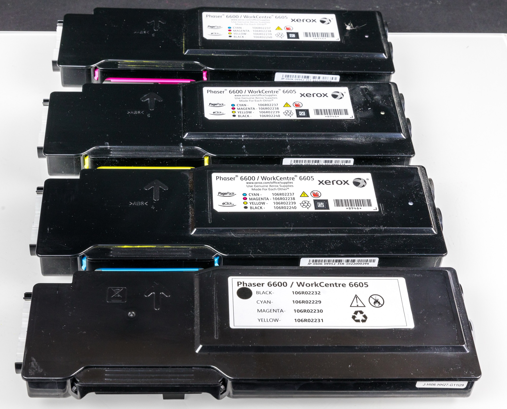 CMYK toner cartridges in a color laser printer