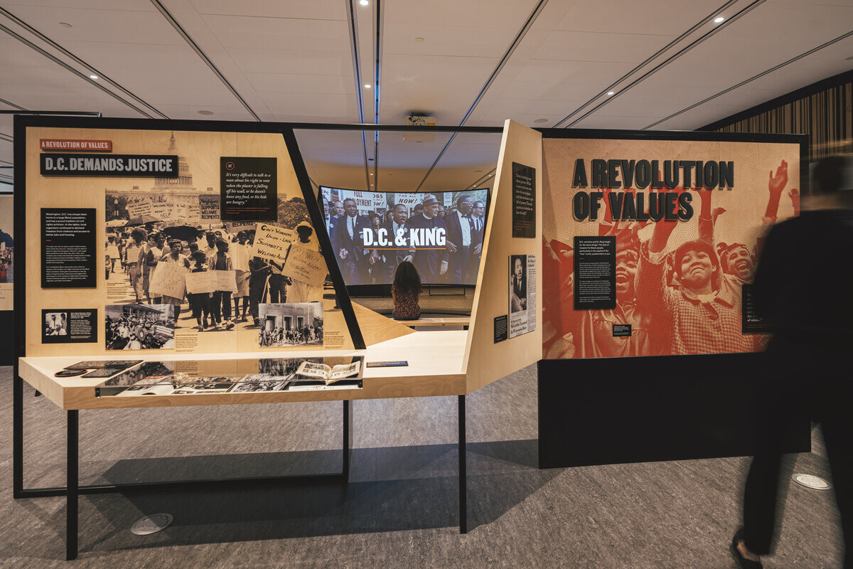 Exhibition graphics in orange and black halftone