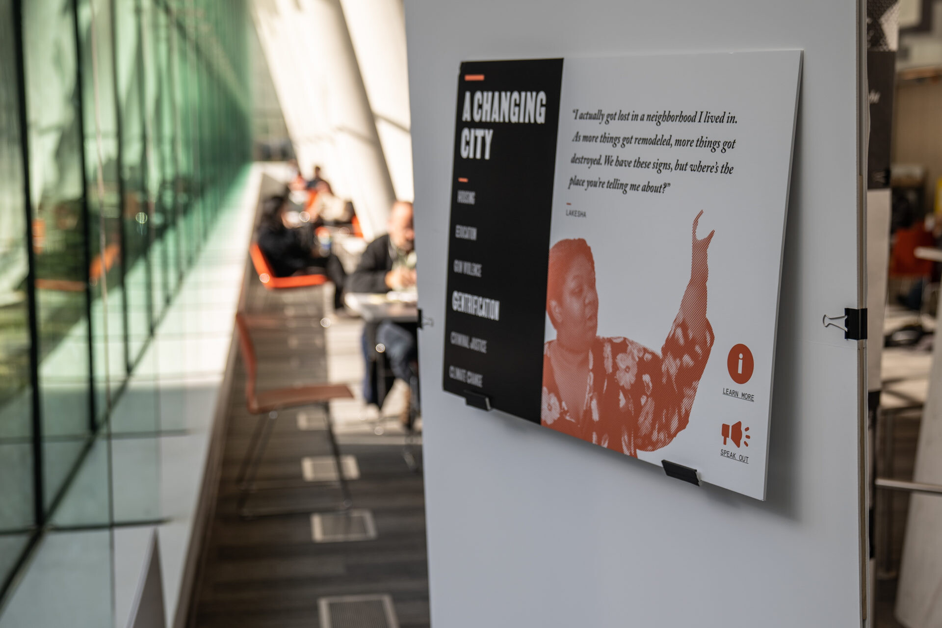 Exhibition graphics in orange and black halftone