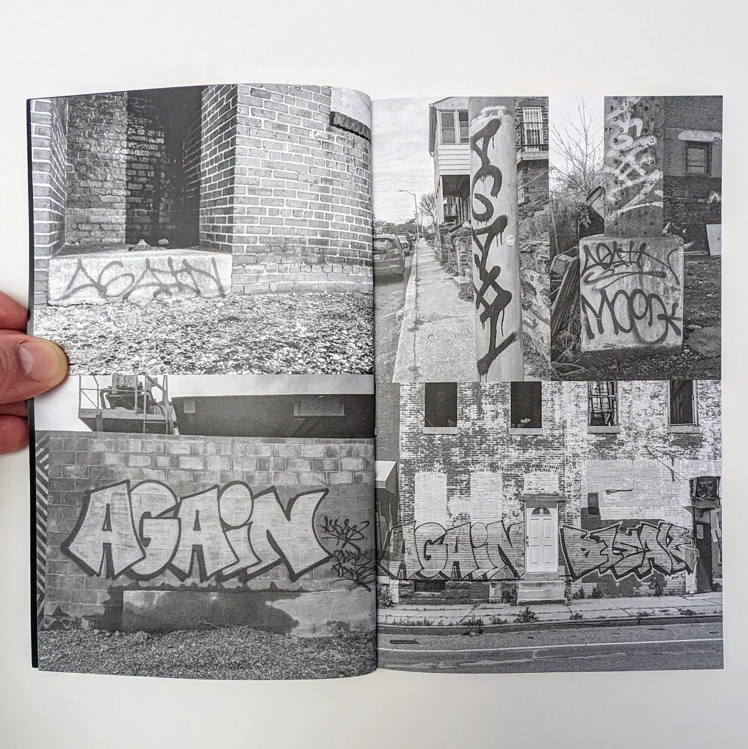 Zine spread: a grid of black and white graffiti photos