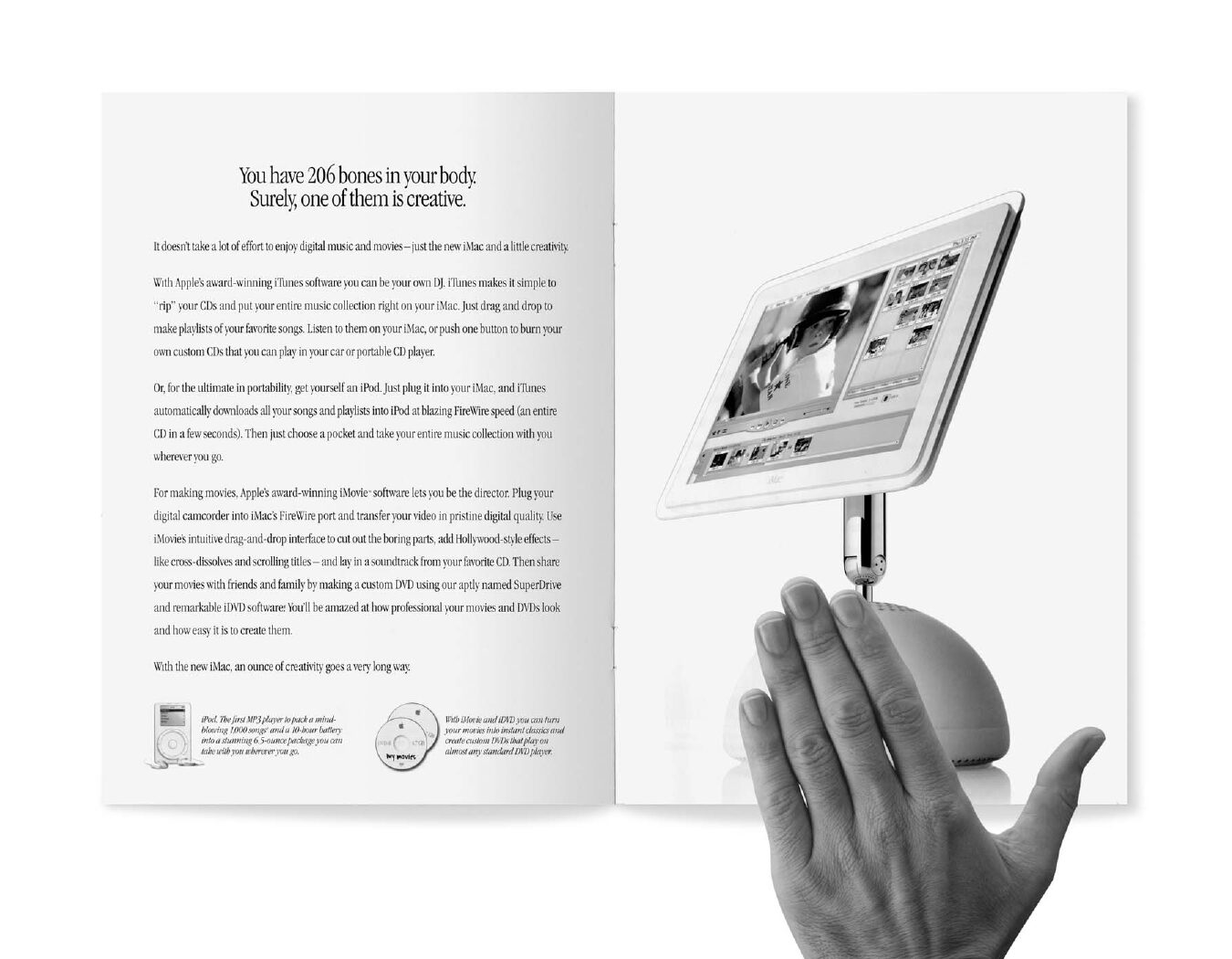 A hand covering the logo on a magazine spread