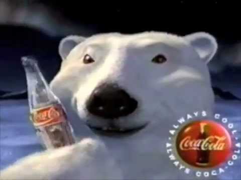 An animated polar bear holding a Coke bottle